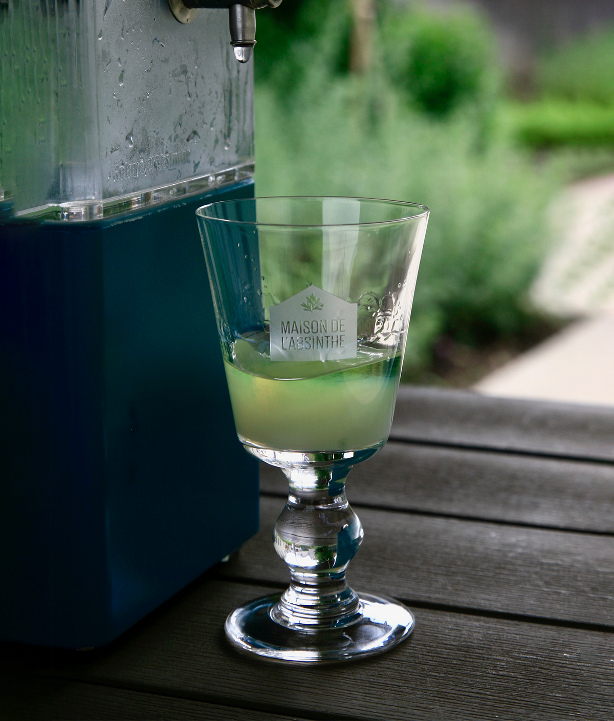 Absinthe verte in the terrace of Maison de l'Absinthe museum with visible louche effect