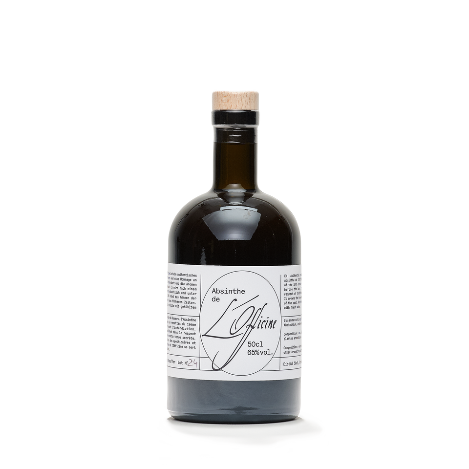 A squat amber apothecary bottle with a cork stopper and a wide typewritten label reading 50 cl, 65% vol.
