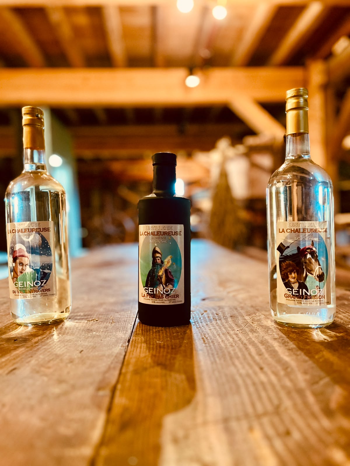 Three Geinoz absinthes on a table in the Boveresse drying house