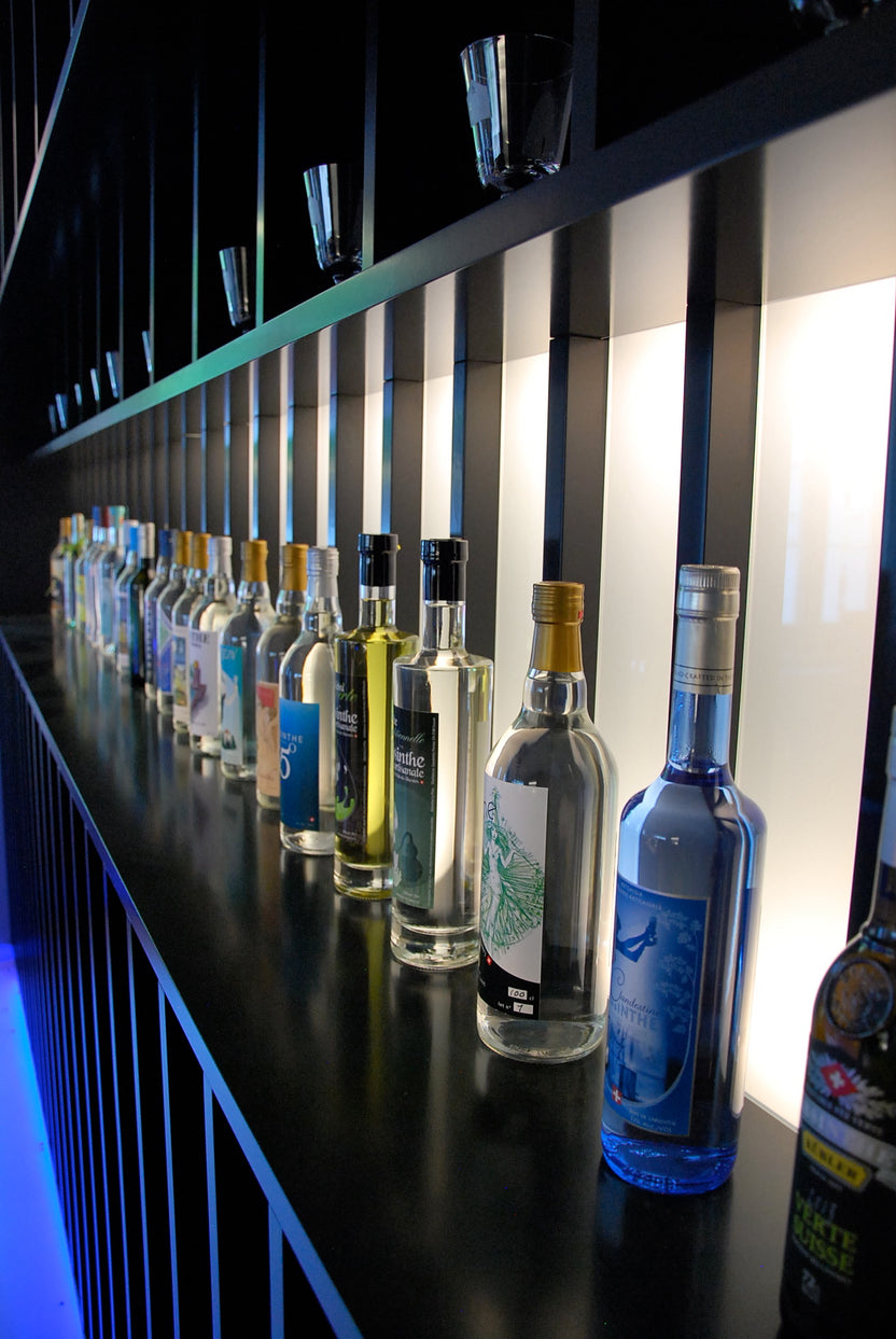 A bar display of absinthe bottles during the 2022 edition of Absinthe en Fête