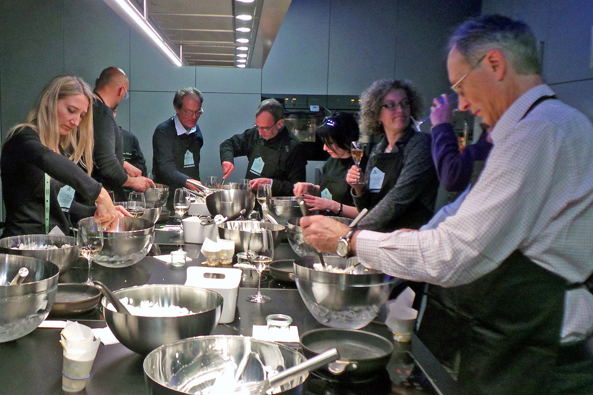 Company team at a culinary workshop with absinthe-themed recipes