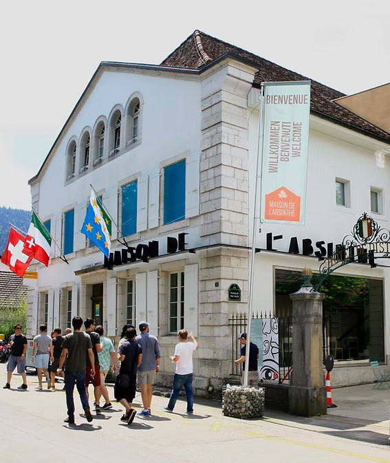 The Maison de l'Absinthe seen from the street, visitors arriving