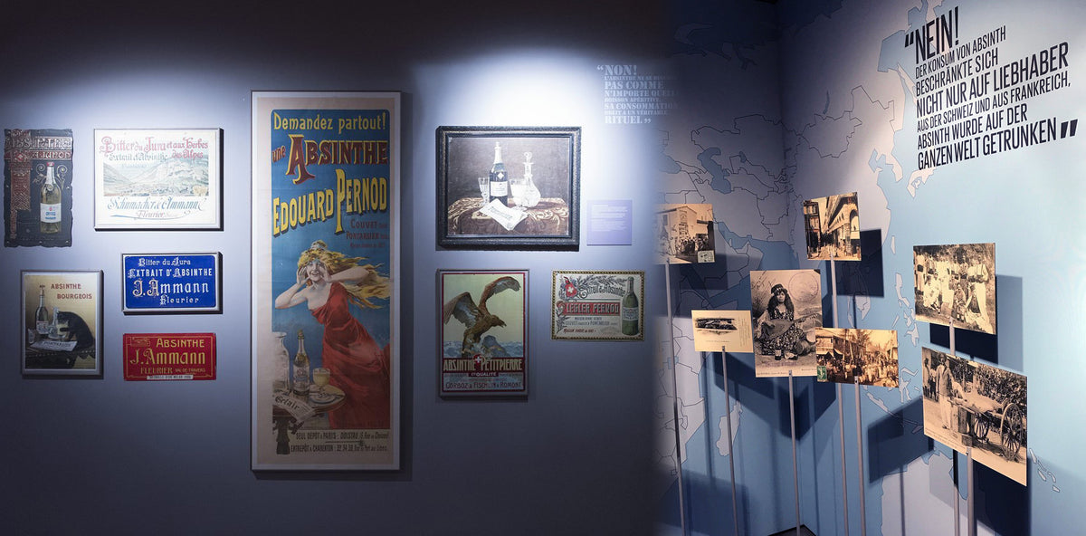 Museum gallery in blue light: original Pernod absinthe posters, framed prints and archive photographs along the wall